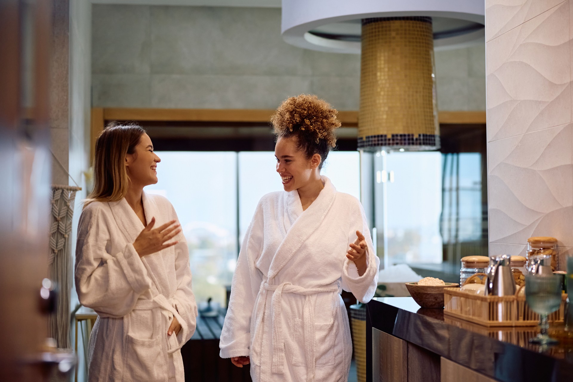 Cheerful women enjoying while spending their weekend at wellness center.